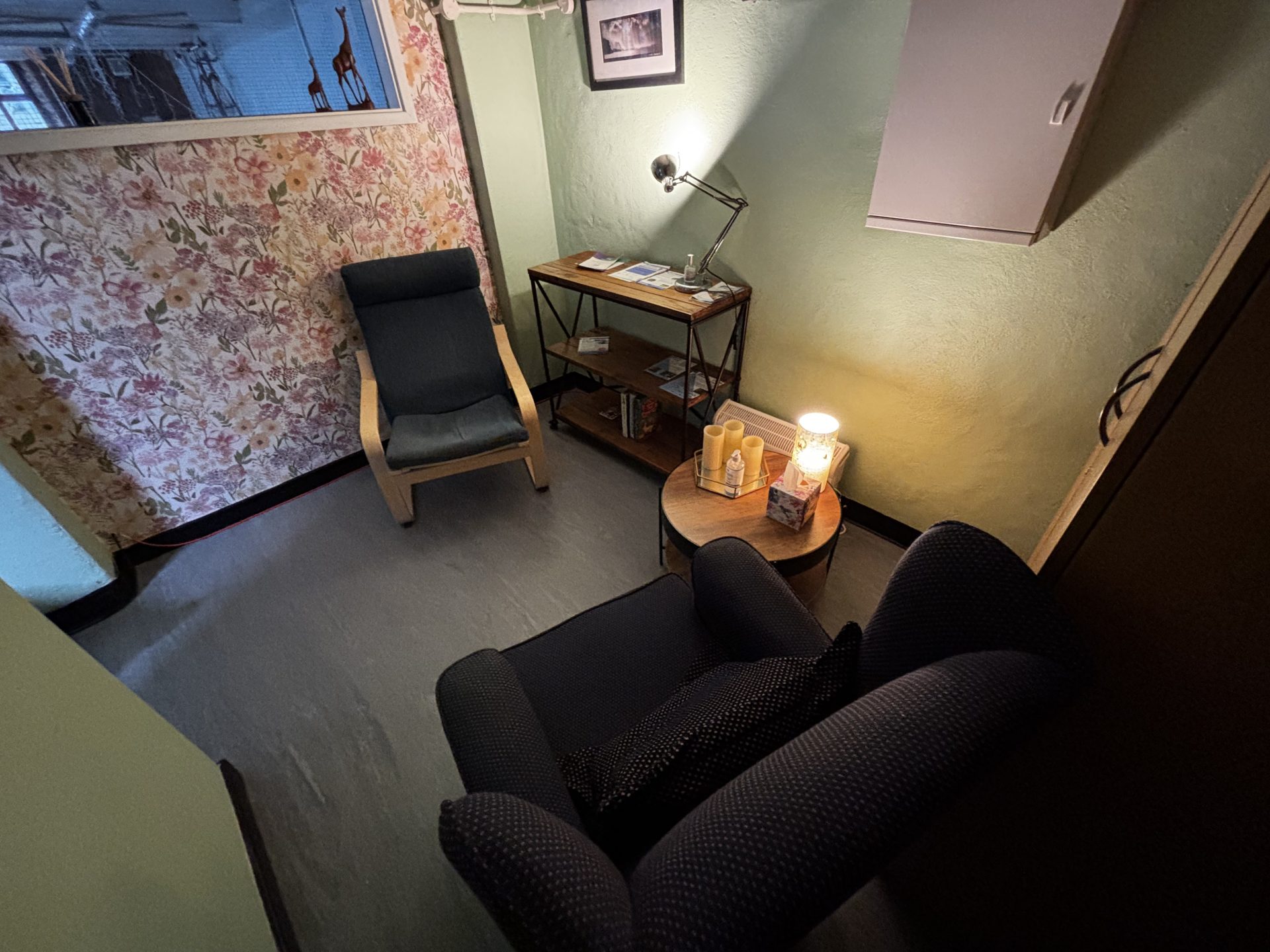 Two chairs and a small table in the counselling room at Cameron House, Lancaster